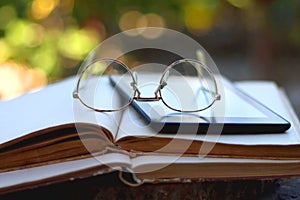 Books, E-Reader and Glasses