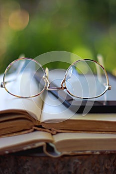 Books, E-Reader and Glasses
