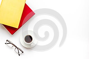 Books with empty cover near glasses, coffee on white desk background top view copyspace