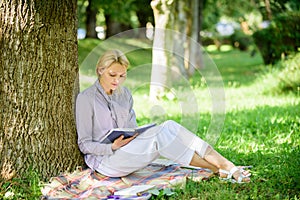 Books every girl should read. Relax leisure an hobby concept. Best self help books for women. Girl concentrated sit park