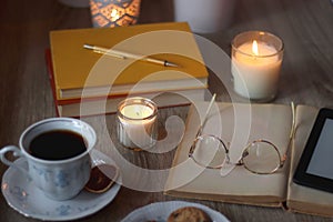 Books, Glasses, E-Reader, Pen, Tea, Cookies and Candles