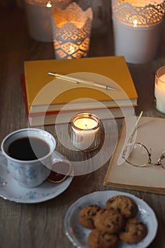 Books, Glasses, E-Reader, Pen, Tea, Cookies and Candles