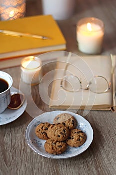 Books, Glasses, E-Reader, Pen, Tea, Cookies and Candles