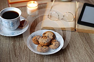 Books, Glasses, E-Reader, Pen, Tea, Cookies and Candles