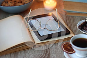 Books, Glasses, Tablet, Tea, Chocolate, Cookies and Candles