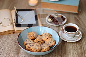 Books, Glasses, Tablet, Tea, Chocolate, Cookies and Candles