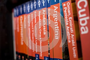 Books of the Lonely Planet series on the bookcase with only the book of Argentina in focus