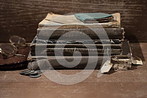 Books over a hundred years old next to glasses