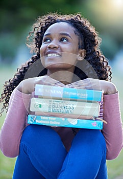 Books, park and black woman thinking of university dream, study goals and reading knowledge in business college. Young