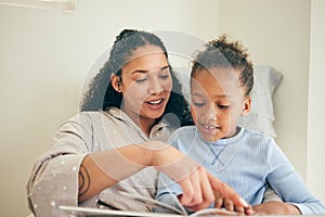 Books, reading and mother with child on bed for bonding time, teaching and learning in happy home. Love, storytelling