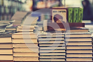 The books are on the shelf in the bookstore. Selective focus. toned