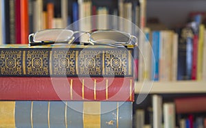 Books with spectacles, library concept