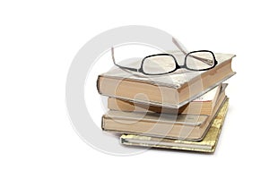 Books stack with eyeglasses