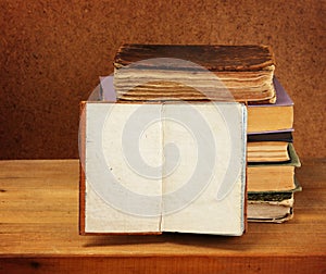 Books stack and opened book