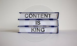 Books with text `content is king` on beautiful white background. Business concept. Copy space