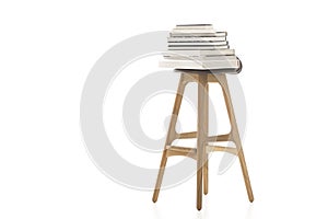 Books on Top of Wooden Leg Chair