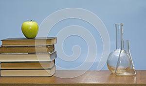 Books and tubes on the desk.