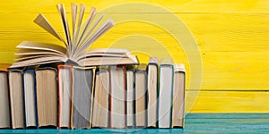 Books on wooden desk table and abstract background. Education background. Copy Space. Back to school.