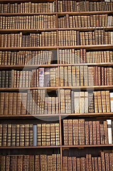 Bookshelf with antique old books in a museum