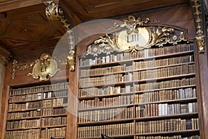 Bookshelf with antique old books in a museum