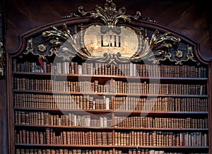 Bookshelf and old books in the State Hall of Austrian National Library - Vienna, Austria