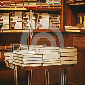 Bookstore with books on table and shelves. Education, school, study, reading concept