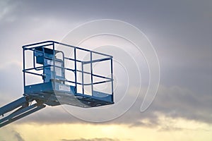 Boom lift against cloudy sky in Eagle Mountain