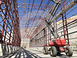 Boom lift picker inside industrial building