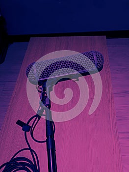 Boom microphones lay down on wood table after using