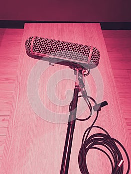 Boom microphones lay down on wood table after using