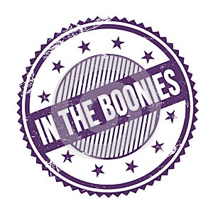 IN THE BOONIES text written on purple indigo grungy round stamp