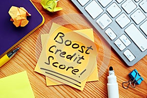 Boost credit score mark on the piece of paper. photo