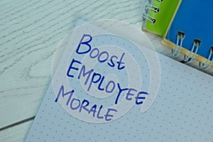 Boost Employee Morale write on a book isolated on office desk photo