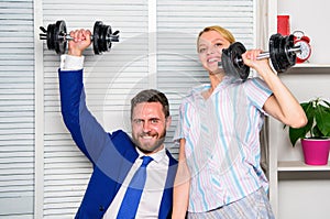 Boost sales with strong strategy. Good job concept. Boss businessman and office manager raise hand with dumbbells. Boost