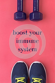 Boost your immune system poster - sports and active lifestyle concept. Purple running shoes and two dumbbells
