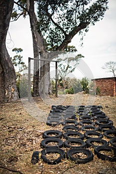 Boot camp with tyres obstacle course and fitness trial