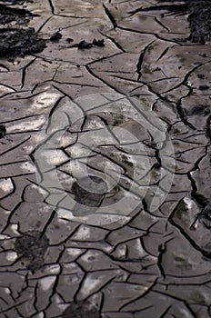 Boot footprints in dry cracked earth