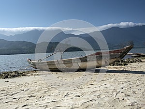 Boot on the shore of lake photo