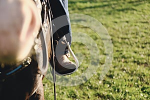 Boot in stirrup while horseback riding