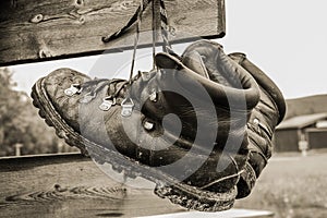 Boots drying hanging on sign post