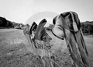 Boots on fence photo