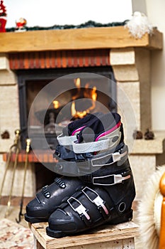 Boots ski boots in front of fireplace