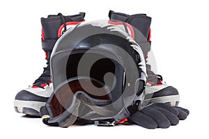 Boots for snowboarding and a protective helmet