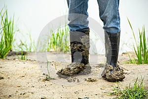 Boots soiled filled with soil densely.