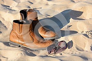 Leather boots and sunglasses