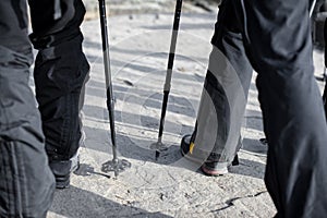 Boots and trekking sticks during trekking in the mountain