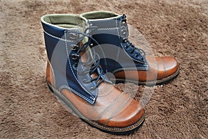 Boots in the wool carpet photo