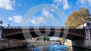 Petit Pont Cardinal Lustiger is an old arch bridge crossing the River Seine Paris France