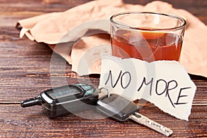 Booze in glass, car keys, paper message.