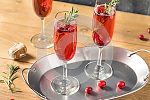 Boozy Refreshing Poinsettia Cranberry Champagne Cocktail